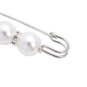 Elegant pearl safety pin brooch with sparkling rhinestone ring on a silver metal base