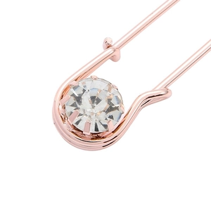 Spilla a balia in oro rosa con grande cristallo rotondo incastonato a griffe di lusso