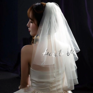 Elegant white double-layered bridal veil with silver Bride to Be print for bachelorette party