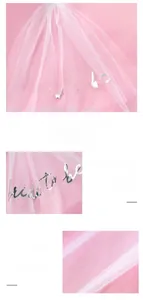 Detail of pink bridal veil featuring silver Bride to Be foil lettering and fine mesh texture