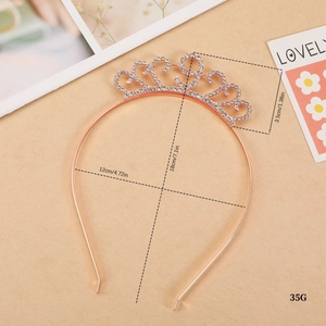 Rose gold birthday crown with white rhinestones and dimensions shown on beige background