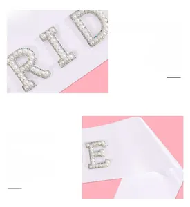Detail of white satin bridal sash with pearl and rhinestone RIDE lettering for parties