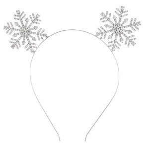 Détail d'un serre-tête argenté avec flocons de neige et strass brillants pour Noël