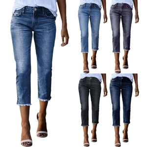 Detail view of slim fit cropped jeans for women with frayed hem in five color options