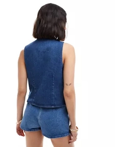 Rear view of trendy blue denim vest and matching shorts set with lace-up detail