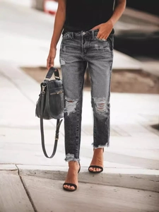Women's vintage dark grey distressed straight-leg denim jeans with ripped knee detail