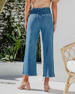 Rear view of high-waisted wide-leg denim jeans showing clean pocket lines and fabric texture