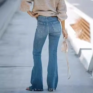 Rear view of vintage blue high waist flare jeans with raw hem and slim fit design