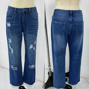 Front and back view of washed blue distressed straight-leg denim jeans with ripped details