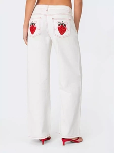 White wide-leg jeans featuring strawberry embroidery and pink bow detail on back pockets