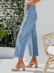 Detailed texture of light blue high-waisted wide-leg jeans with side pockets