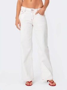 White straight-leg denim jeans featuring bold red contrast stitching and metal button