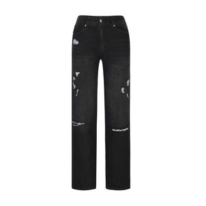 Detail of distressed charcoal black straight-leg jeans with ripped holes and washed denim