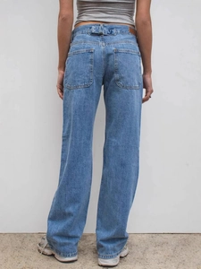 Women's vintage washed blue high-waist baggy jeans with back pocket and buckle detail