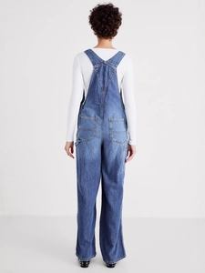 Fashionable loose-fit blue denim overalls for women featuring an X-back design and pockets