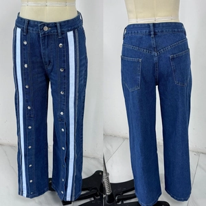 Front and back view of wide-leg denim pants featuring white side stripes and metal buttons