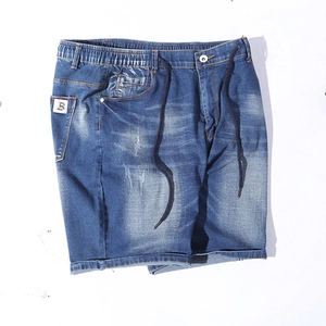 Flat lay of blue stretch denim shorts featuring elastic waist with drawstring and B-label