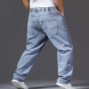 Detail view of men's wide leg jeans featuring elastic waist and back pockets
