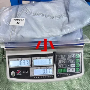 S size light blue washed straight denim jeans weighing 363.7g on an electronic scale