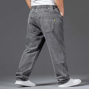 Rear view of men's loose fit grey washed jeans showing back pockets and waistband detail