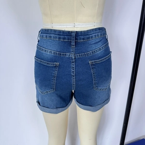 Rear view of denim shorts showing washed fabric texture and folded hem details