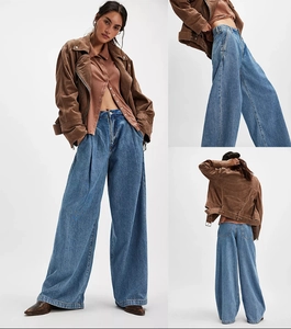 Vues détaillées du jean en denim délavé bleu foncé à taille haute et jambe large