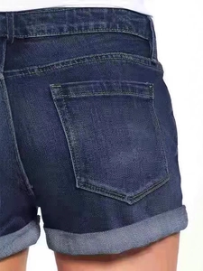 Back view of high-waisted dark blue denim shorts with cuffed hems and classic pockets