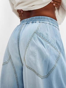 Women's light blue casual trousers with elastic waist and large patch pockets details