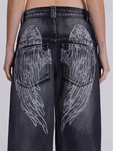 Jean large vintage gris foncé délavé avec motif ailes et clous argentés au dos