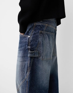 Detail of vintage blue workwear denim jeans with hammer loop and contrast stitching