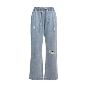 Detail of high-waisted distressed light blue jeans with drawstring elastic waistband