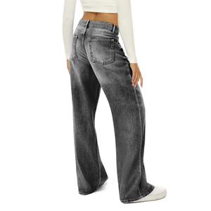 Close-up detail of vintage high-waisted wide-leg denim pants in washed grey finish