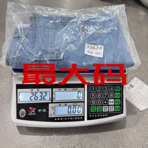 Macro weight check of XXL light blue distressed denim shorts on an industrial scale