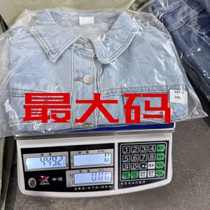 Weight measurement of a light blue denim jacket size 3XL on a digital industrial scale