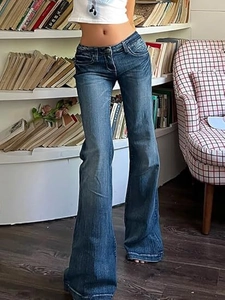 Vintage dark blue low-rise flared jeans with washed texture and Y2K retro slim fit style