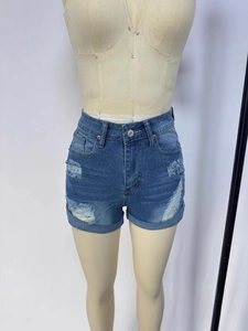 Summer high waisted blue denim shorts with distressed ripped holes and folded cuffs style