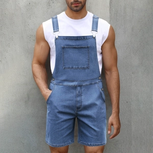 Detail of blue denim overalls shorts with front pocket and adjustable silver buckles