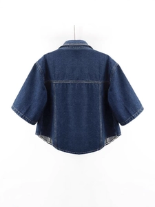 Deep blue denim short sleeve jacket with a dropped shoulder and minimalist curved hem