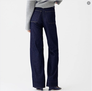 Detail view of high waist dark indigo wide leg jeans with classic contrast stitching