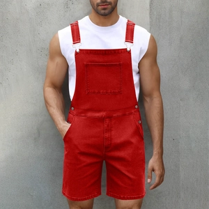 Detail of red denim overalls for men featuring a chest pocket and metallic buckle straps