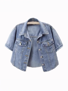 Short sleeve light blue denim jacket with metal buttons and chest pockets on wooden hanger