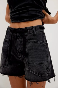 Detailed view of black washed denim shorts with eyelet drawstring and cargo pockets