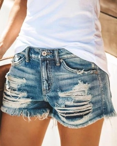 Women's mid-blue ripped denim shorts with fringe hem and heavy distressed street style details