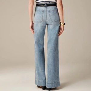 Rear view of high-waisted wide-leg jeans with back pockets and stitched hem detail