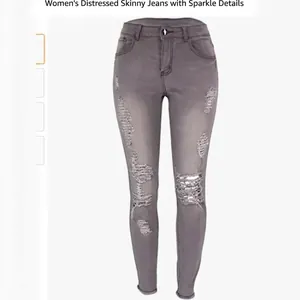 Damen Skinny Jeans in Grau mit hoher Taille und markanten Destroyed-Effekten auf Weiß