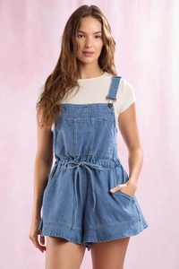 Detail of light blue denim overalls romper with waist drawstring and chest pocket