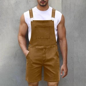 Detail of men's brown denim overalls with adjustable metal buckles and chest pockets
