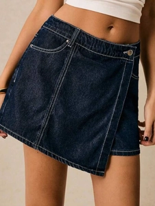 Detailed view of dark blue wash skort with contrast stitching and wrap design