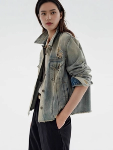 Vintage wash denim jacket for women featuring distressed details and raw hem in slim fit