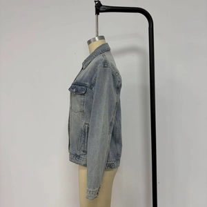 Detailed side view of a light blue denim jacket featuring classic pockets and retro wash